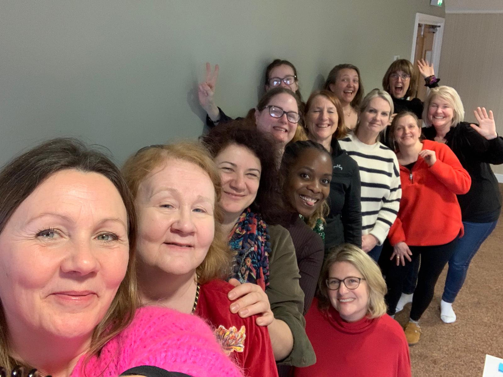 the ladies of Accelerating Women's Enterprise (AWE) posing for a selfie