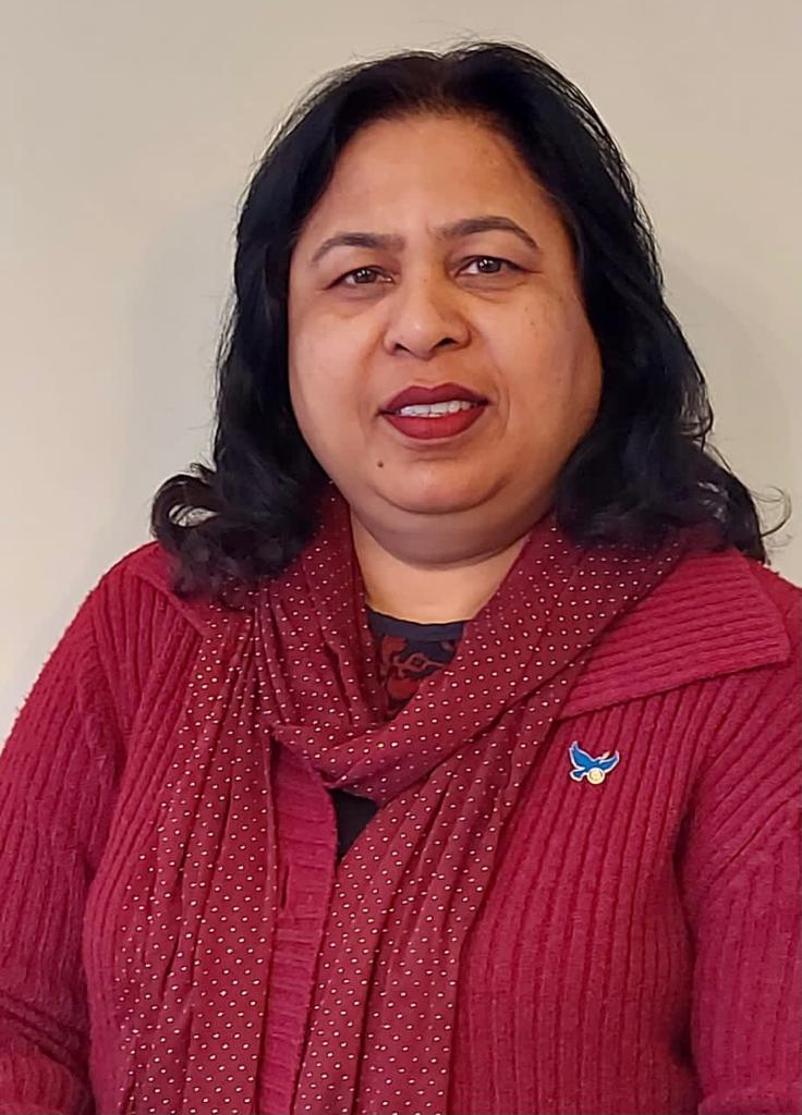Nagina in a red scarf and cardigan